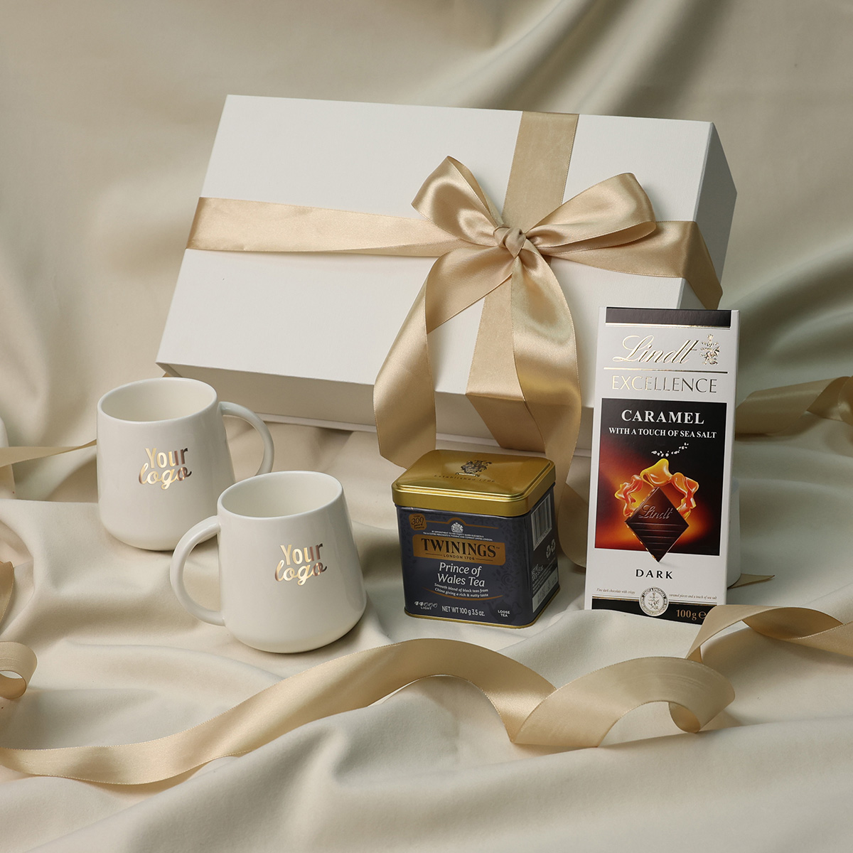Luxury tea gift set with two branded mugs, Twinings tea, and Lindt chocolate